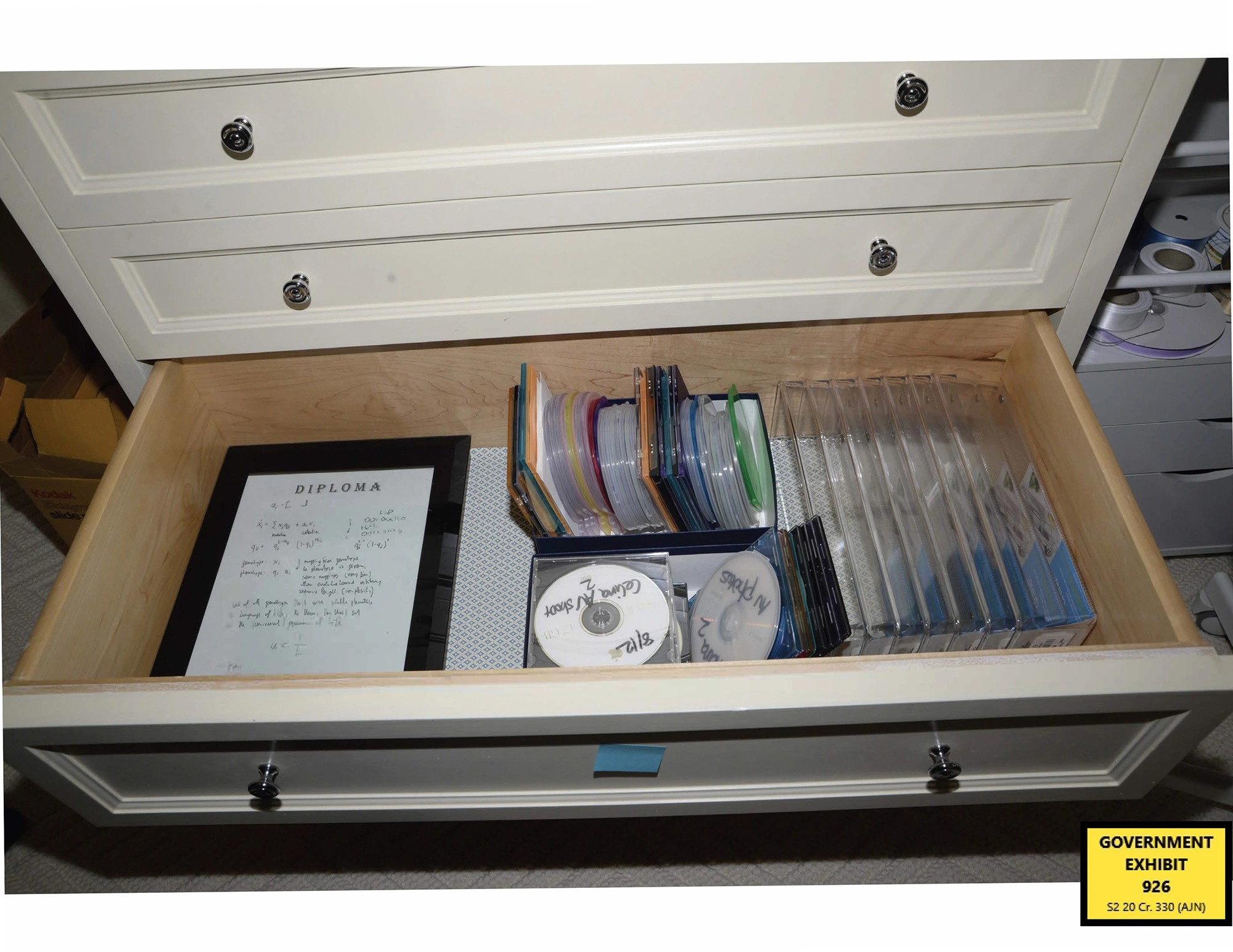 Epstein CDs Manhattan Federal Ghislaine Maxwell trial evidence exhibits. Jeffrey Epstein's UES New York City home. Police raid images. A cache of illicit CDs found on the fifth floor.