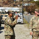 Home 5 California National Guard Soldiers from the 143rd Military Police Battalion and the California State Guard from the 143rd Military Police Support Detachment collaborate to establish a new area of operation in Malibu, near the Palisades fire area, Calif., on Feb. 11, 2025.