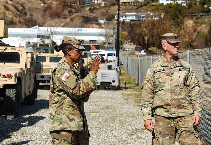 California National Guard Soldiers from the 143rd Military Police Battalion and the California State Guard from the 143rd Military Police Support Detachment collaborate to establish a new area of operation in Malibu, near the Palisades fire area, Calif., on Feb. 11, 2025.